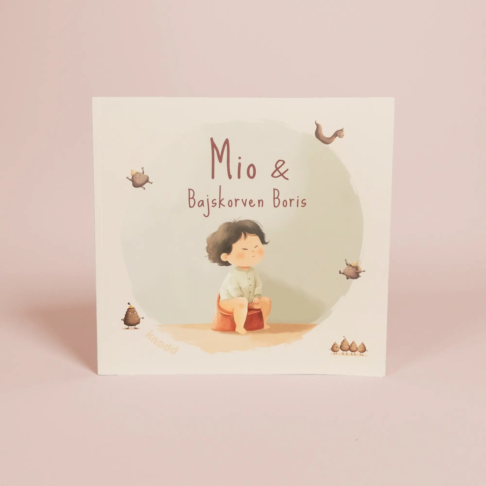 Illustrerad barnbok om potträning med tecknat barn som sitter på pottan